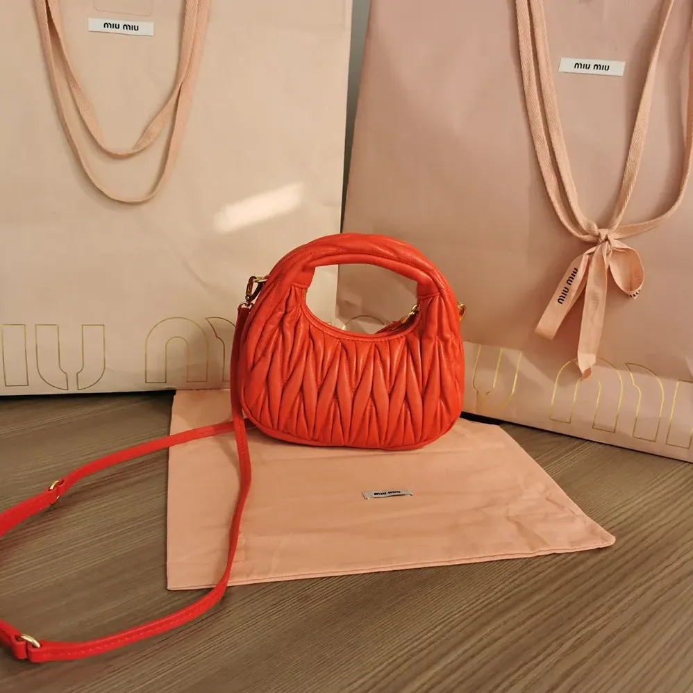 Miu Miu Wander Matelassé Nappa Leather Hobo Mini-Bag for Women in Red Miu Miu Wander Matelassé Nappa Leather Hobo Mini-Bag for Women in Red