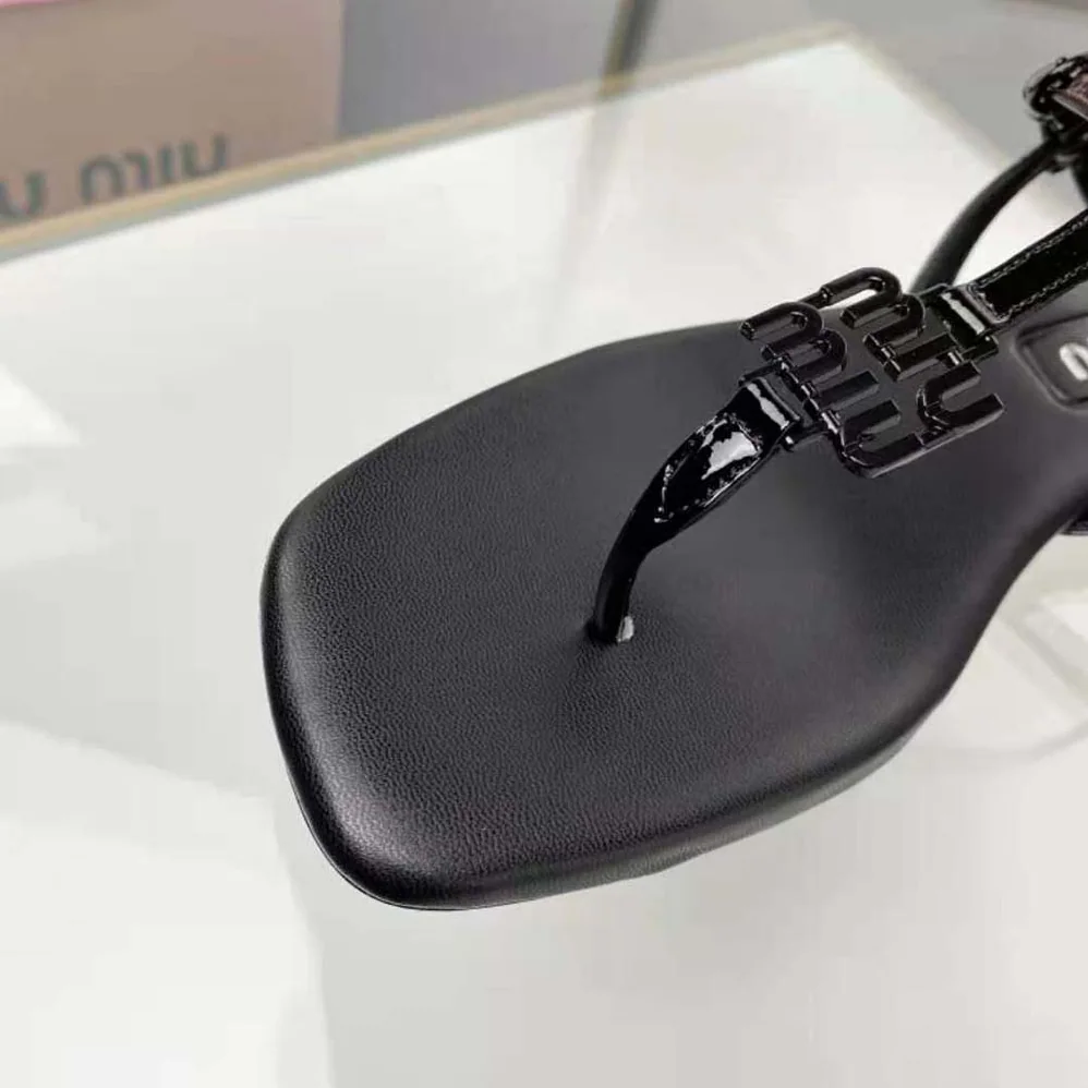 Miu Miu Patent Thong Sandals with Metal Lettering Logo for Women in Black Miu Miu Patent Thong Sandals with Metal Lettering Logo for Women in Black