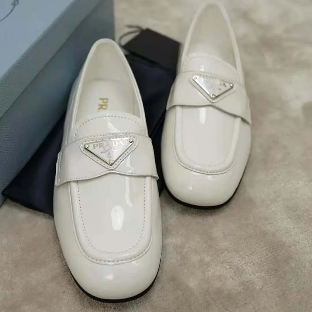 Prada Patent Leather Loafers in 5mm Heel for Women in White Prada Patent Leather Loafers in 5mm Heel for Women in White