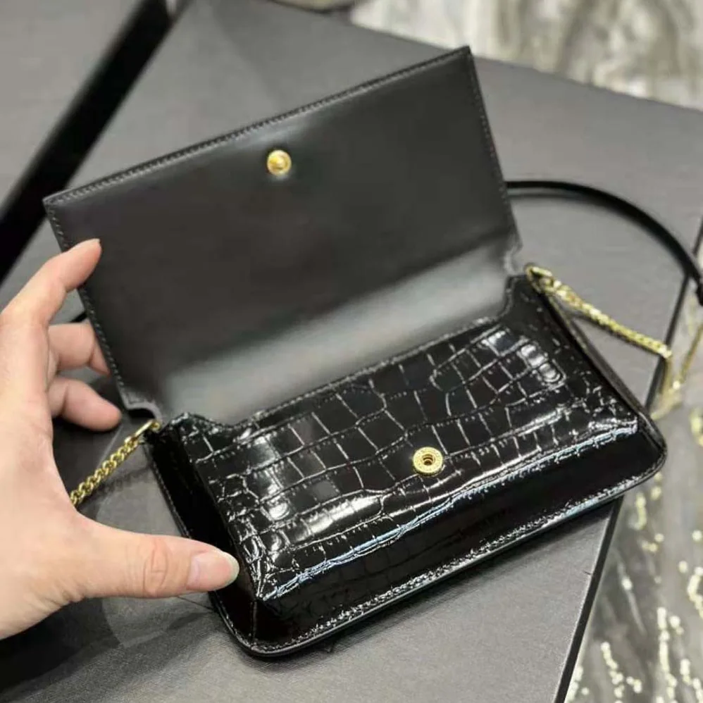 Saint Laurent YSL Cassandre Phone Holder with Strap in Shiny Crocodile-Embossed Leather for Women in Black Saint Laurent YSL Cassandre Phone Holder with Strap in Shiny Crocodile-Embossed Leather for Women in Black