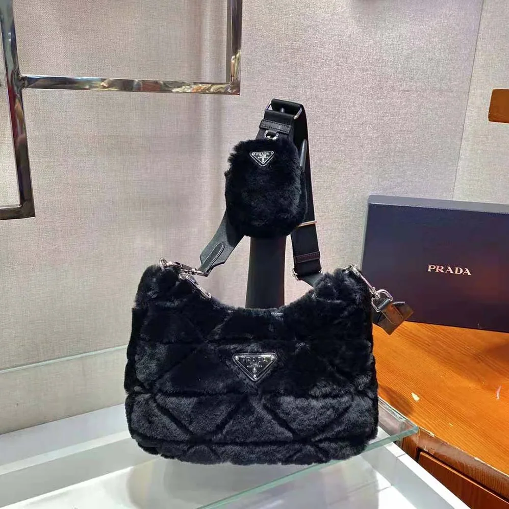 Prada A Patchwork-style Triangle Motif Characterizes Shearling Shoulder Bag for Women in Black Prada A Patchwork-style Triangle Motif Characterizes Shearling Shoulder Bag for Women in Black