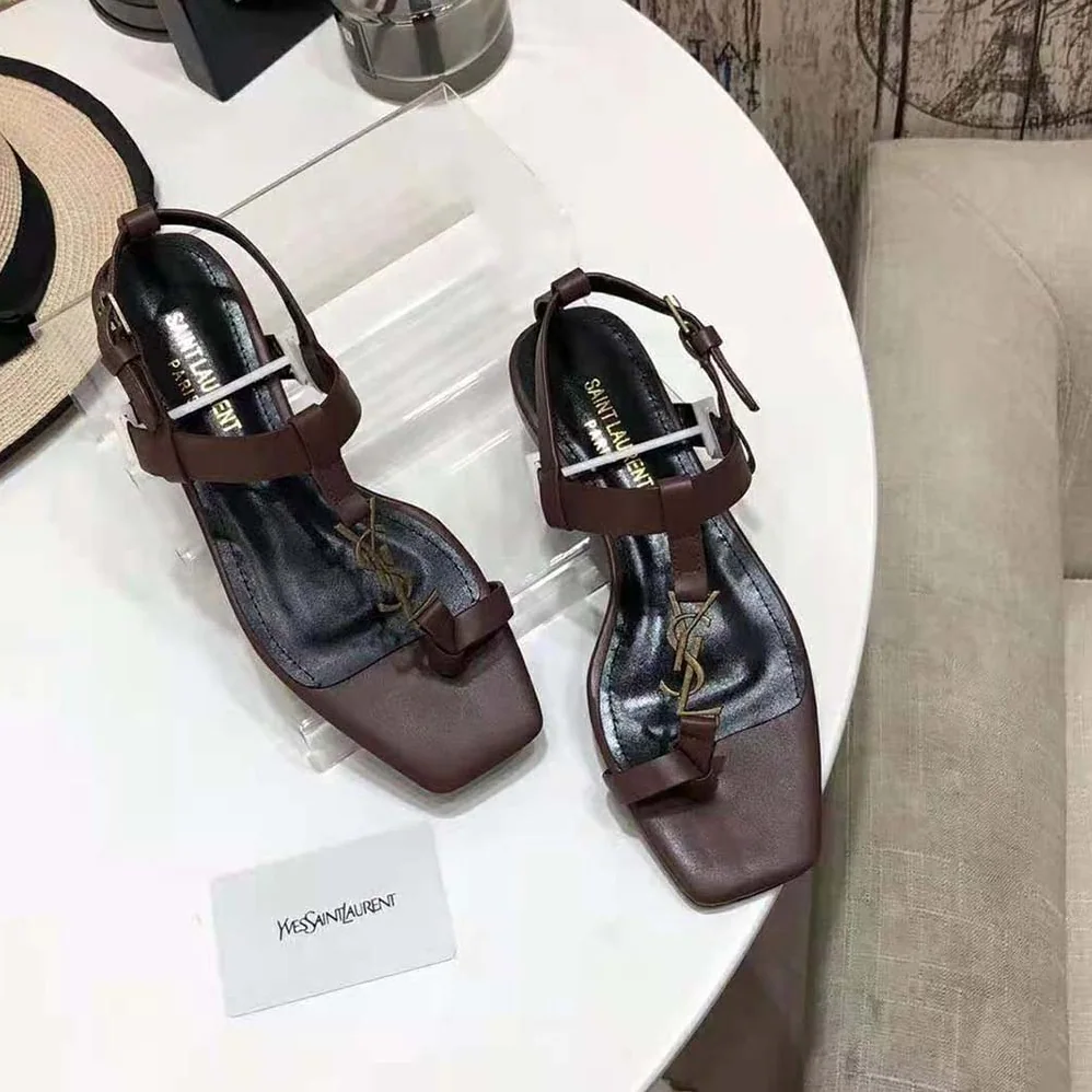 Saint Laurent YSL Cassandra Flat Sandals in Smooth Leather with Gold-Tone Monogram for Women in Brown
