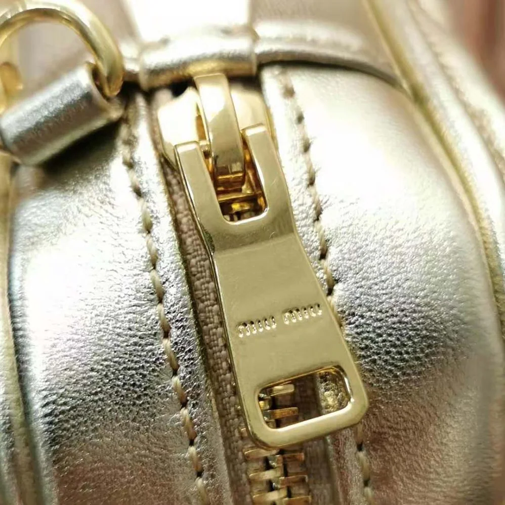 Miu Miu Matelassé Nappa Leather Top-Handle Mini-Bag for Women in Gold