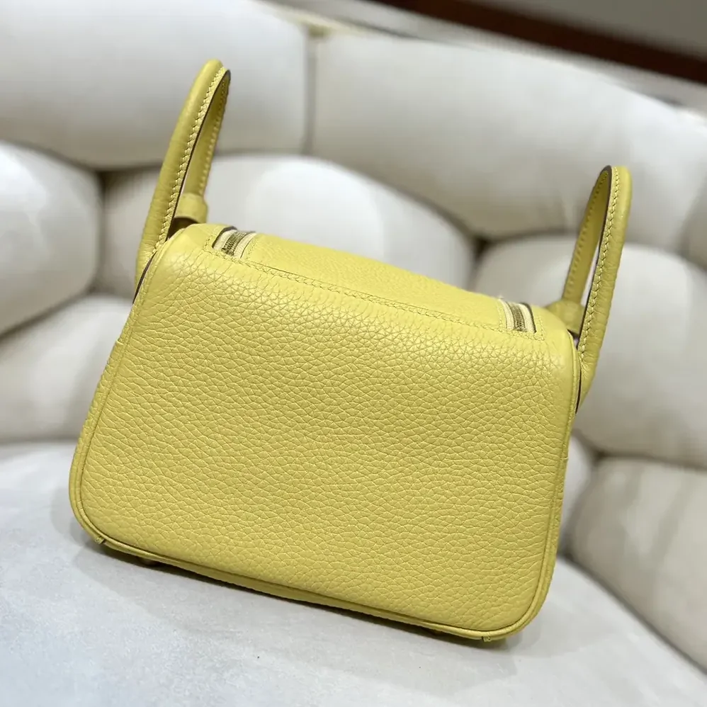 Hermes Lindy Mini 19 in Clemence Leather for Women in Yellow/Gold Hermes Lindy Mini 19 in Clemence Leather for Women in Yellow/Gold