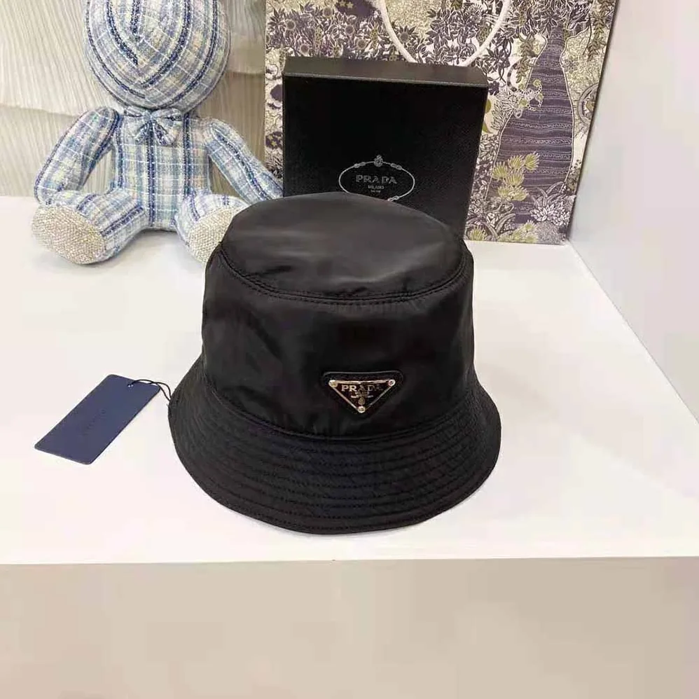 Prada Nylon Bucket Hat Decorated with the Triangle Logo for Women in Black Prada Nylon Bucket Hat Decorated with the Triangle Logo for Women in Black