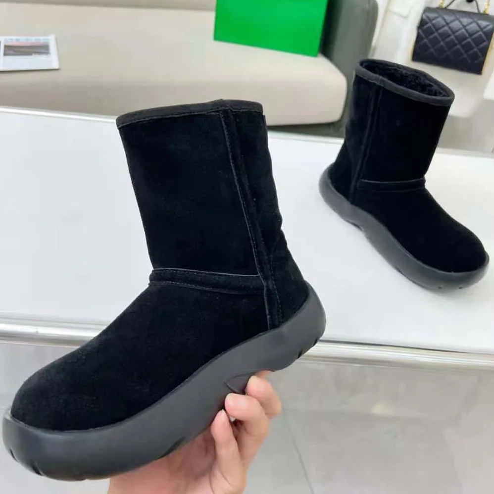 Bottega Veneta Snap Ankle Boot Realised in Shearling Calfskin for Unisex in Black Bottega Veneta Snap Ankle Boot Realised in Shearling Calfskin for Unisex in Black