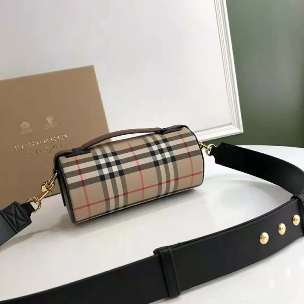 Burberry The Icon Stripe E-canvas and Leather Barrel Bag for Women in Brown Burberry The Icon Stripe E-canvas and Leather Barrel Bag for Women in Brown