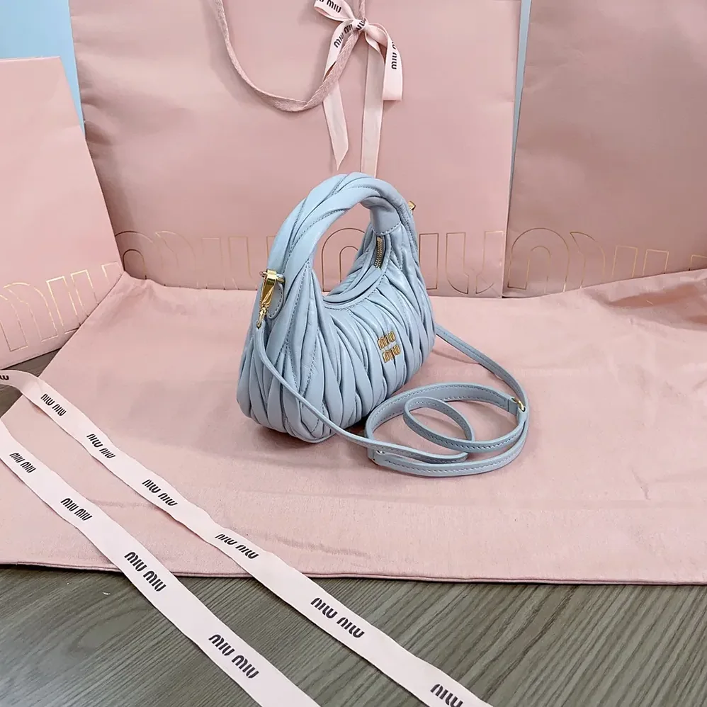 Miu Miu Wander Matelassé Nappa Leather Hobo Mini-Bag for Women in Powder Blue Miu Miu Wander Matelassé Nappa Leather Hobo Mini-Bag for Women in Powder Blue