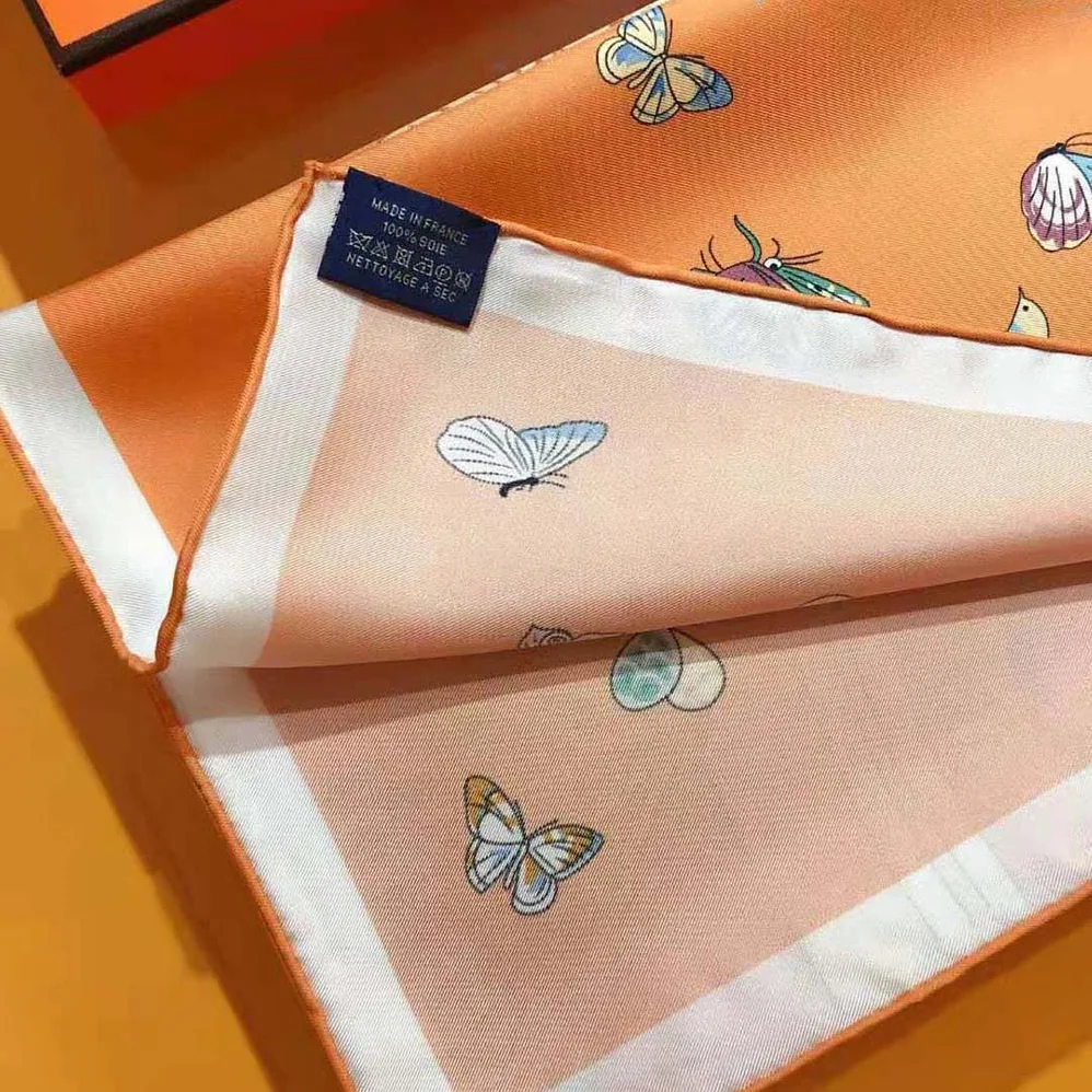 Hermes Hermes Story Scarf 90 in Silk Twill with Hand-Rolled Edges for Women in Orange