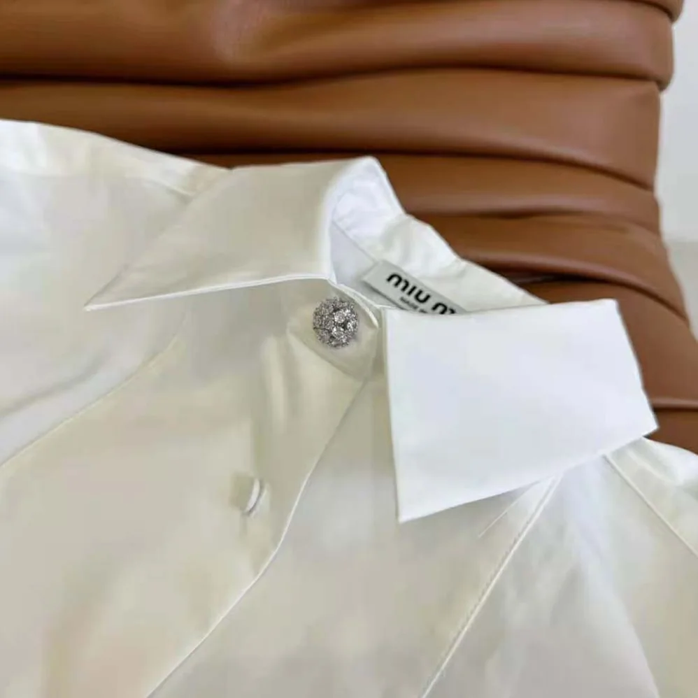 Miu Miu Poplin Shirt with Yarn-Embroidered Logo for Women in White Miu Miu Poplin Shirt with Yarn-Embroidered Logo for Women in White