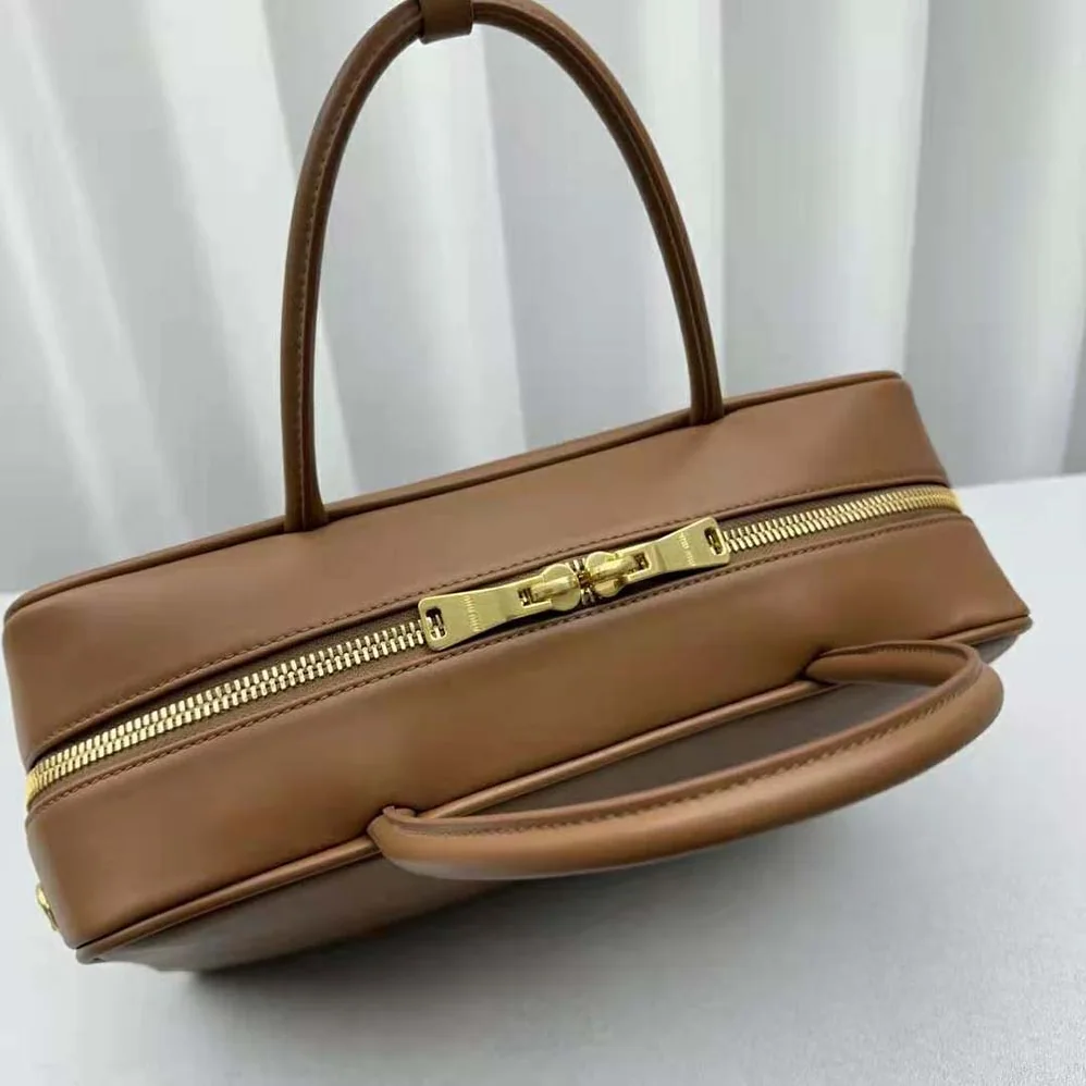 Miu Miu Leather Top-handle Bag with Embossed Lettering Logo for Women in Brown Miu Miu Leather Top-handle Bag with Embossed Lettering Logo for Women in Brown