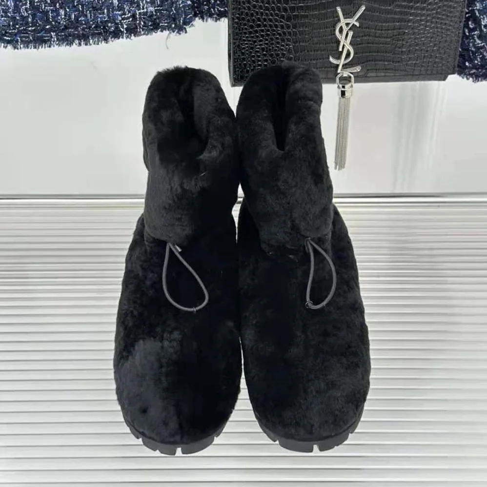 Prada Shearling Booties with Enameled Metal Triangle Logo for Women in Black