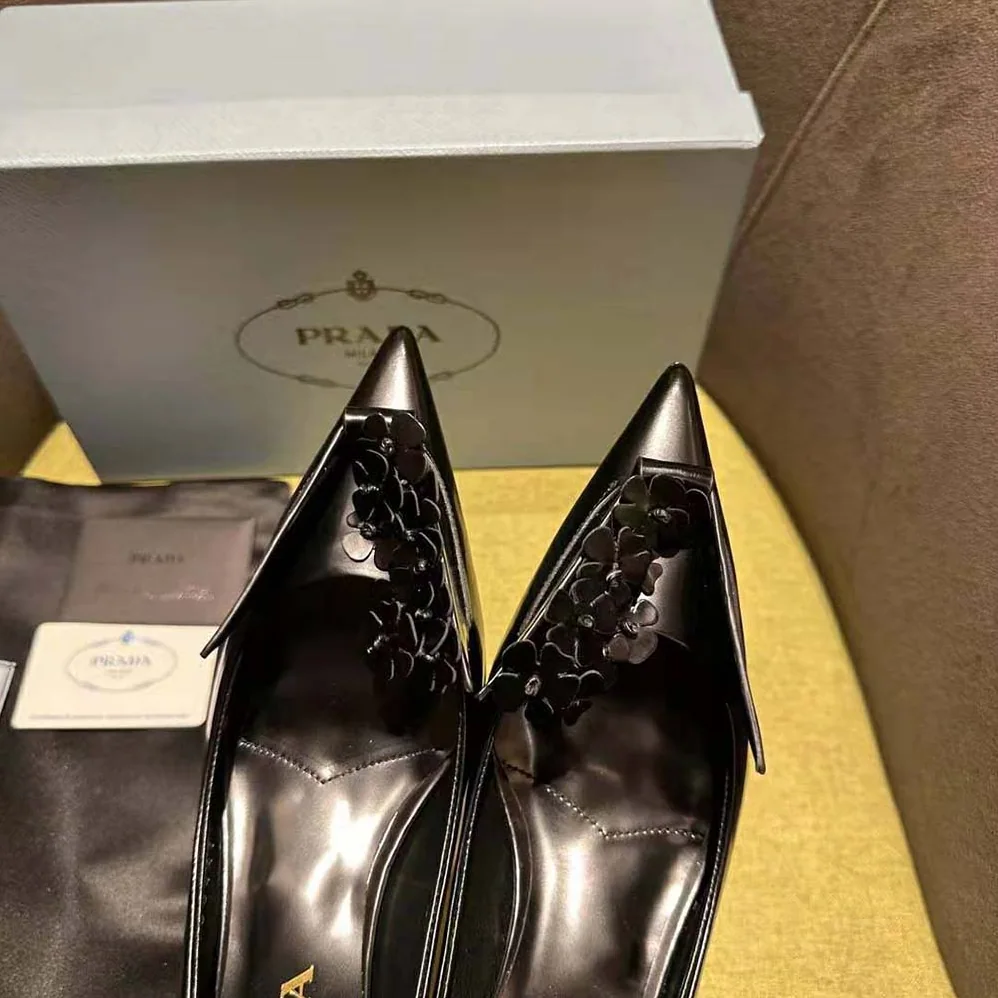 Prada Brushed Leather Pumps with Floral Appliqués for Women in Black
