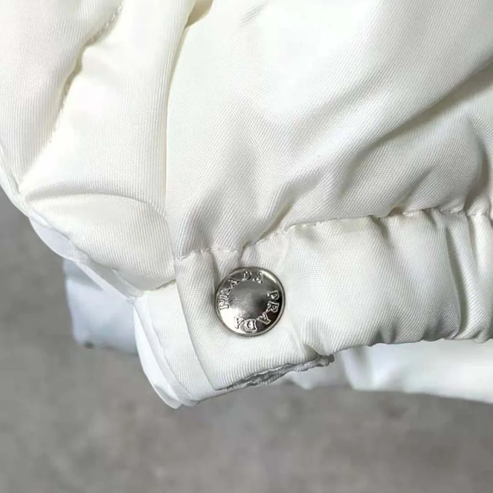 Prada Re-Nylon Down Jacket for Women in White Prada Re-Nylon Down Jacket for Women in White