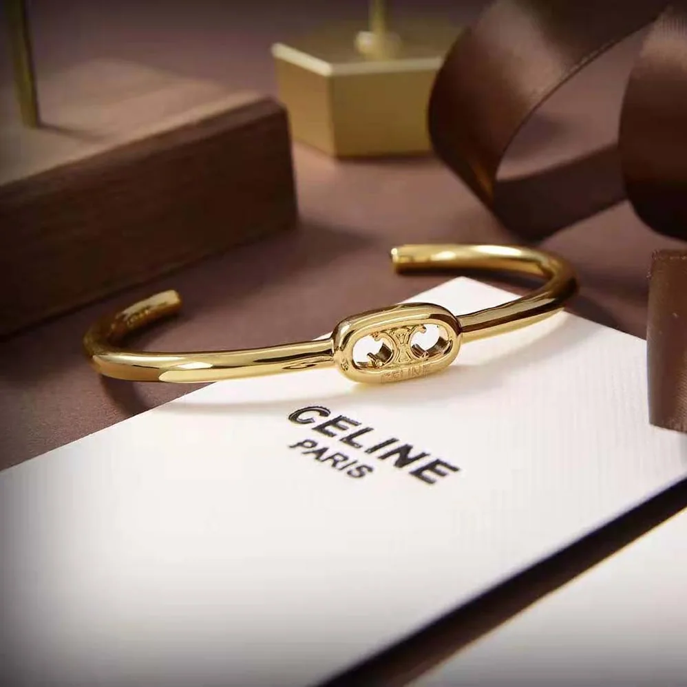 Celine Maillon Triomphe Thin Cuff in Brass with Gold Finish for Women
