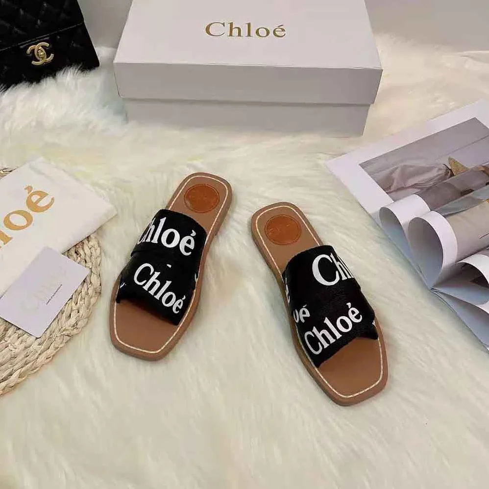 Chloe Woody Flat Mule in Canvas for Women in Black Chloe Woody Flat Mule in Canvas for Women in Black