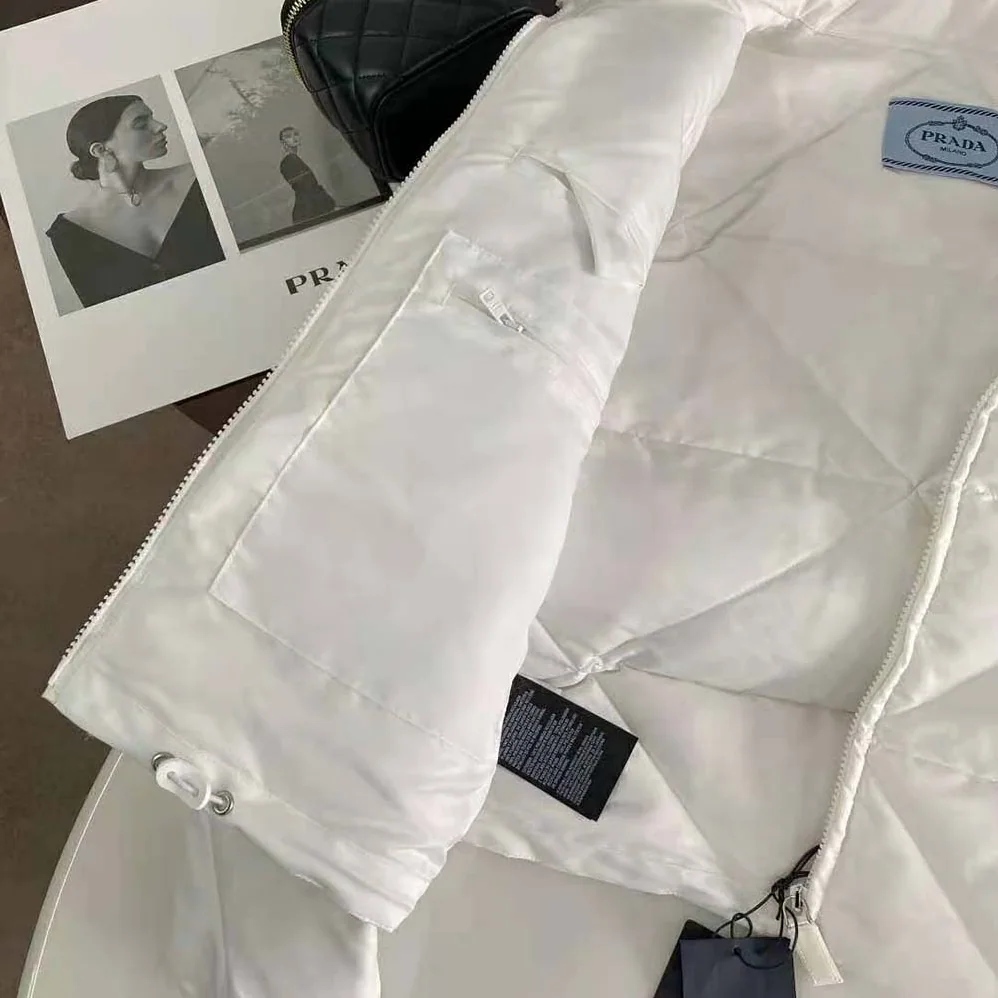 Prada Re-Nylon Gabardine Cropped Down Jacket for Women in White Prada Re-Nylon Gabardine Cropped Down Jacket for Women in White