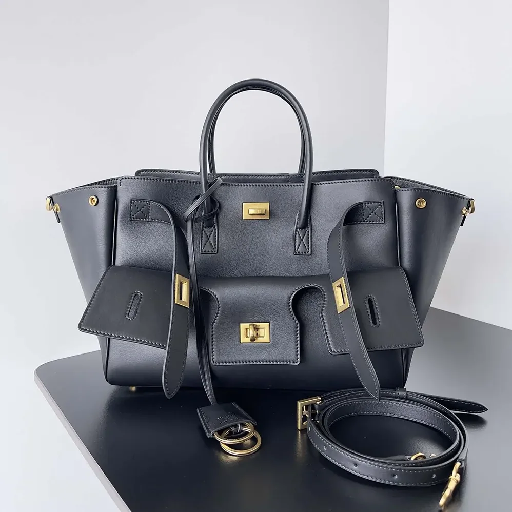 Balenciaga Bel Air Small Carry All Bag in Black Smooth Calfskin for Women in Gold Balenciaga Bel Air Small Carry All Bag in Black Smooth Calfskin for Women in Gold
