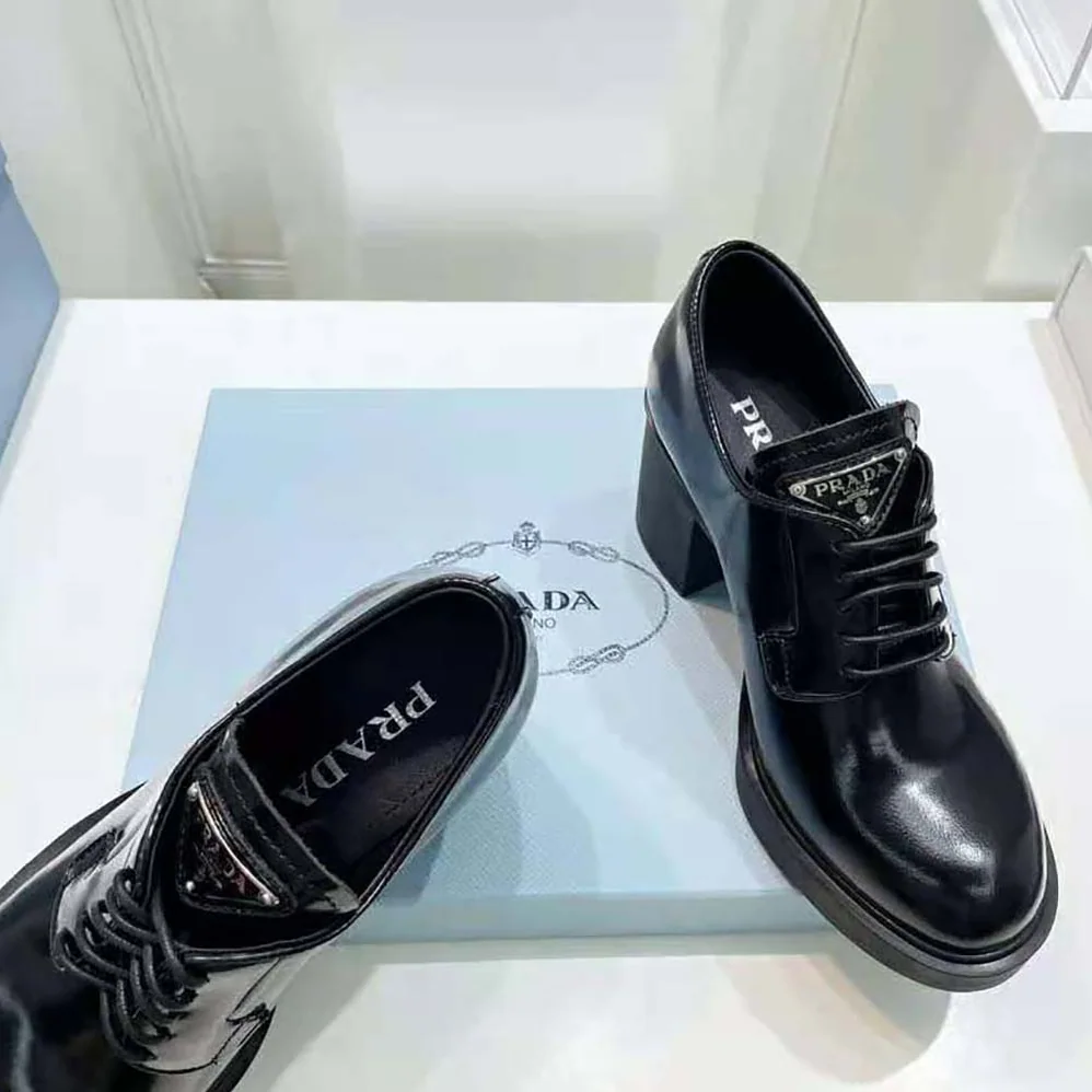 Prada Heeled Brushed Leather Lace-Ups for Women in Black Prada Heeled Brushed Leather Lace-Ups for Women in Black