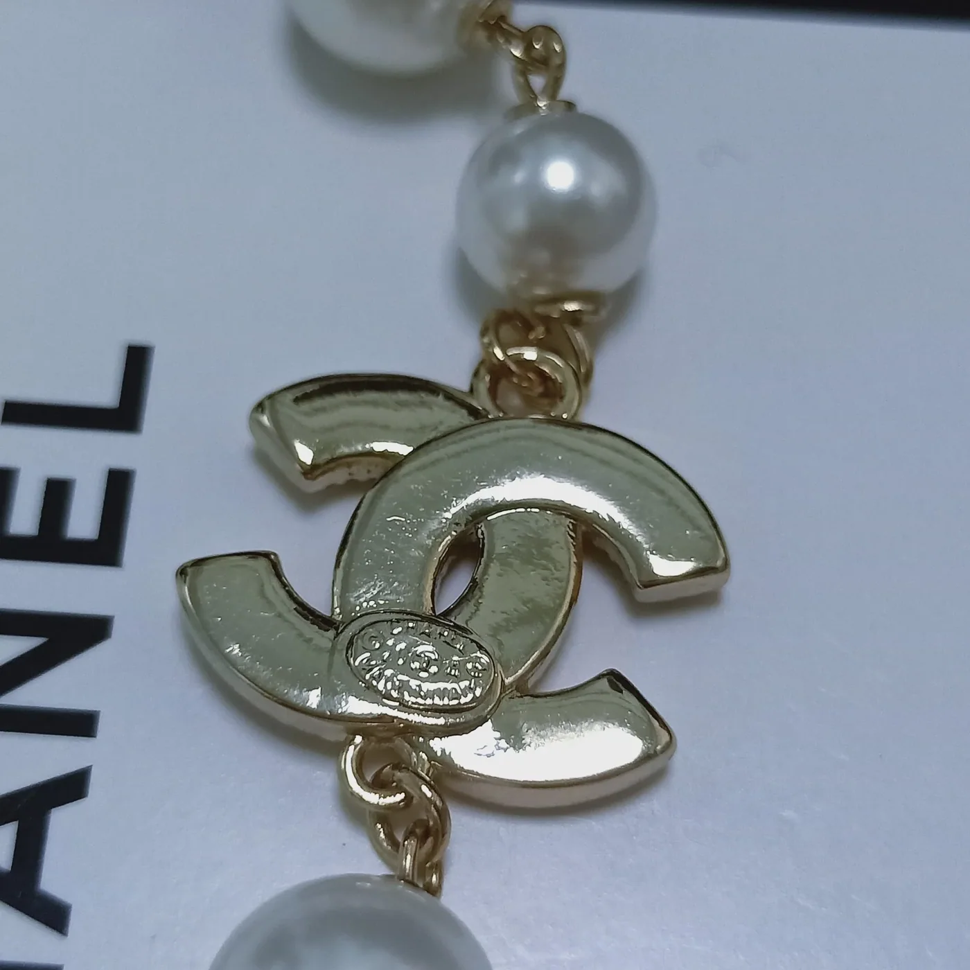 Chanel Three Chanel Iconics Pearl Necklace White Chanel Three Chanel Iconics Pearl Necklace White