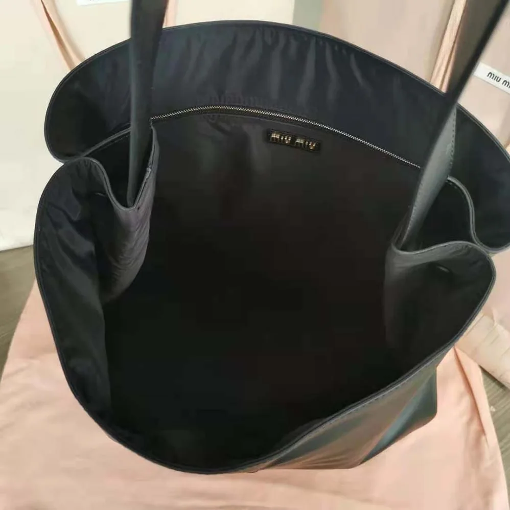 Miu Miu Leather Shoulder Bag with Embossed Lettering Logo on the Front for Women