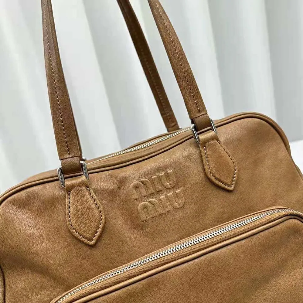 Miu Miu Nappa Leather Top-handle Bag with Embossed Lettering Logo for Women in Brown