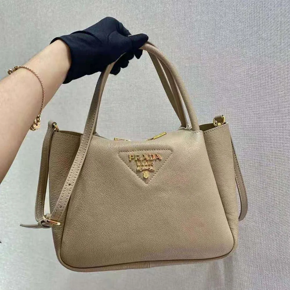 Prada Small leather Handbag with the Prada Metal Lettering Logo Illuminating Its Center for Women in Sandy