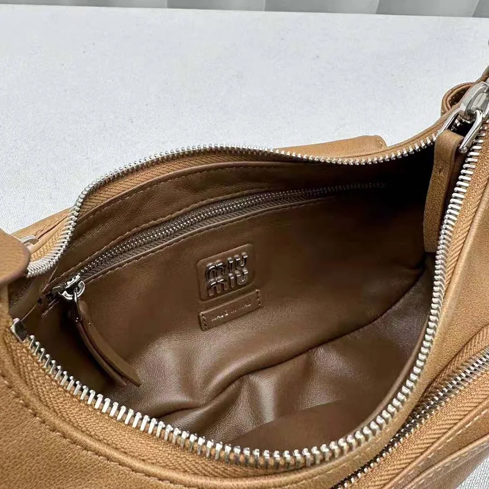 Miu Miu Pocket Nappa Leather Bag with Embossed Lettering Logo for Women in Brown Miu Miu Pocket Nappa Leather Bag with Embossed Lettering Logo for Women in Brown