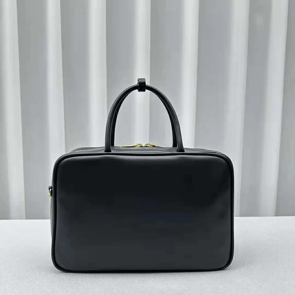 Miu Miu Leather Top-handle Bag with Embossed Lettering Logo for Women in Black Miu Miu Leather Top-handle Bag with Embossed Lettering Logo for Women in Black