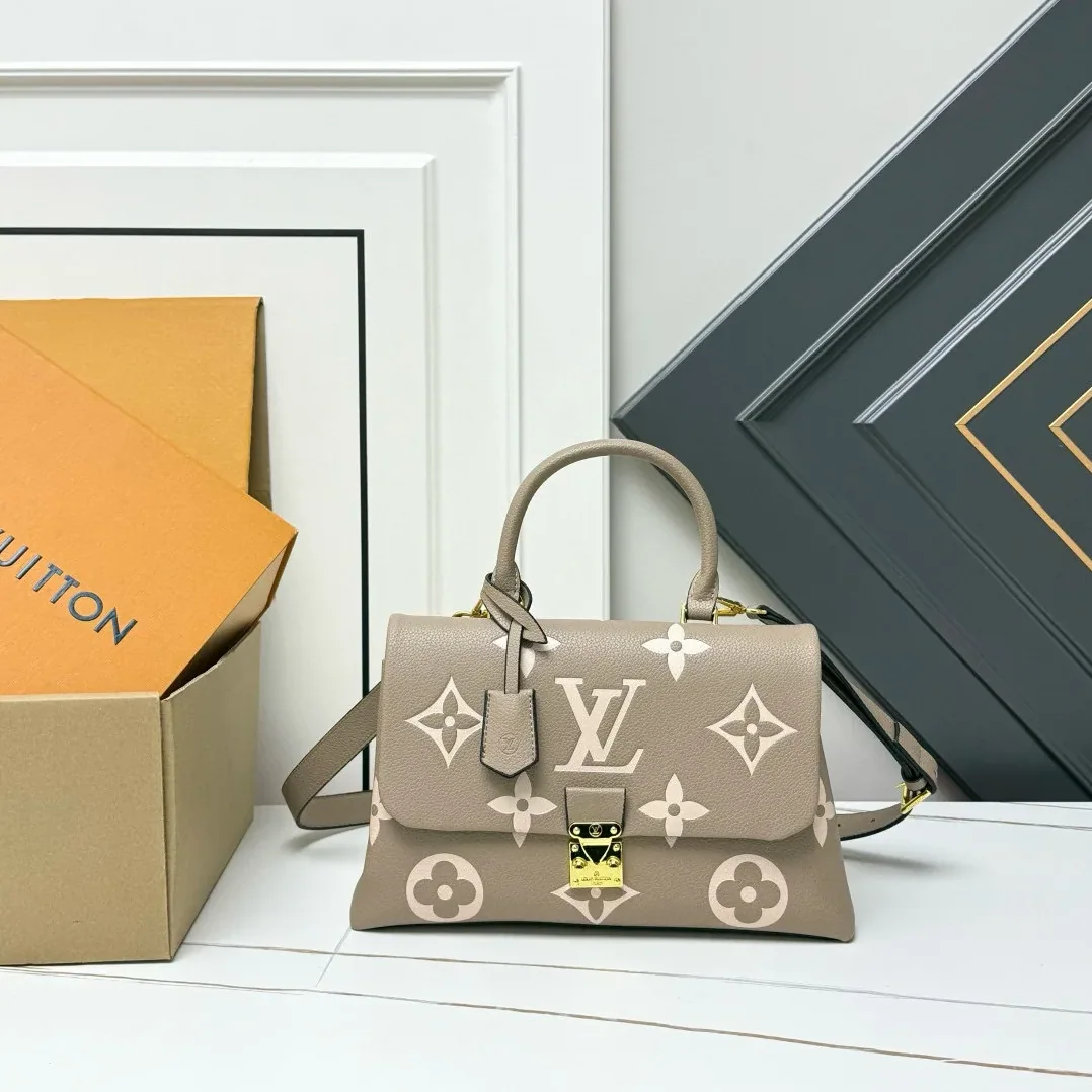 Louis Vuitton Madeleine MM Monogram Empreinte Dove Gray in Creme Beige