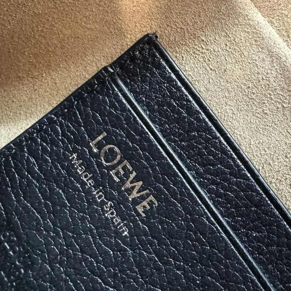 Loewe Small Pebble Messenger Bag in Supple Grained Calfskin for Unisex in Black