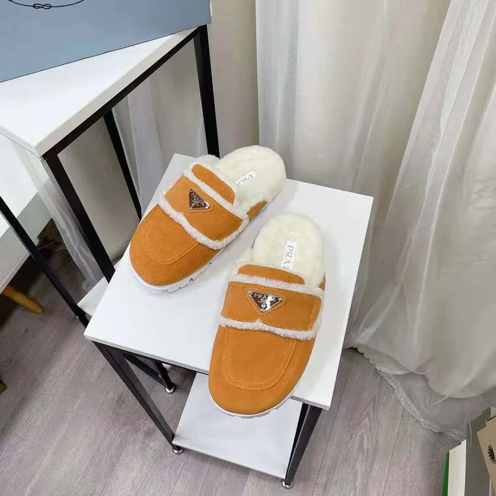 Prada Shearling Slippers Enameled Metal Triangle Logo for Women in Yellow Prada Shearling Slippers Enameled Metal Triangle Logo for Women in Yellow