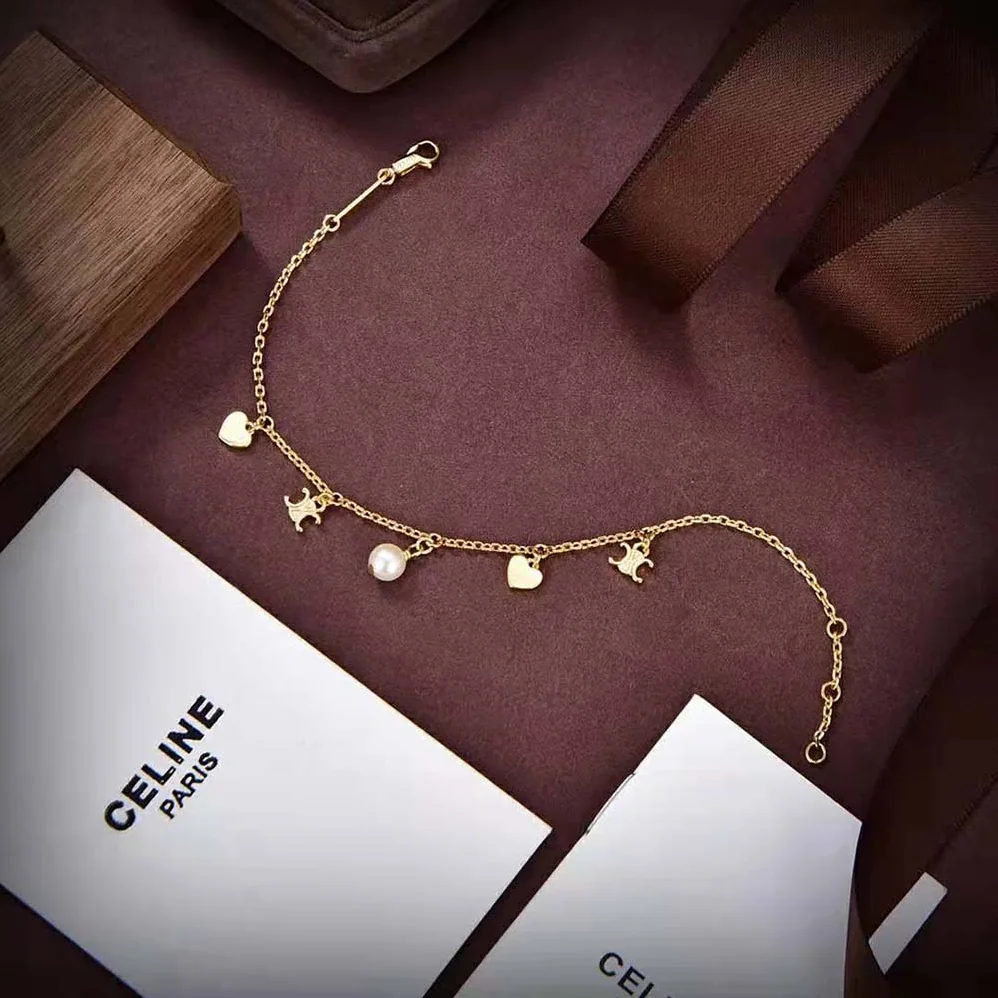 Celine Cœur Celine Charms Necklace in Brass with Gold Finish and Resin Pearl for Women Celine Cœur Celine Charms Necklace in Brass with Gold Finish and Resin Pearl for Women