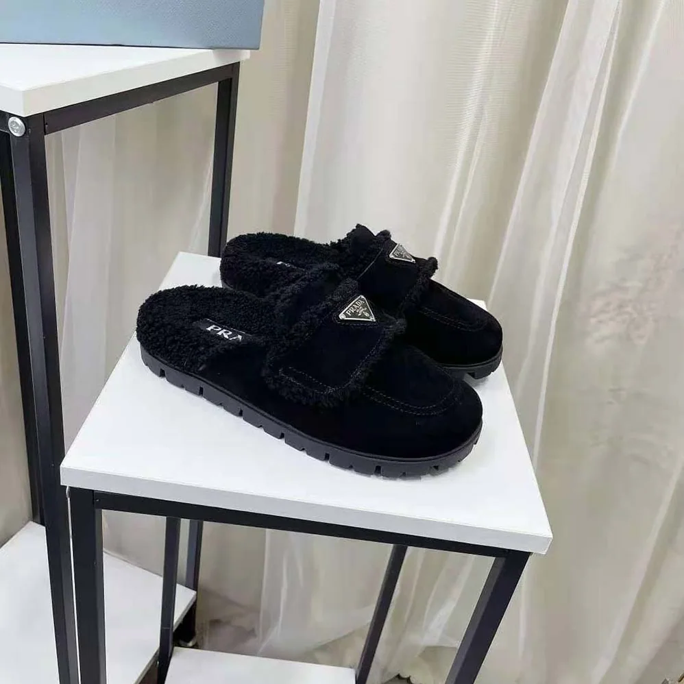 Prada Shearling Slippers Enameled Metal Triangle Logo for Women in Black