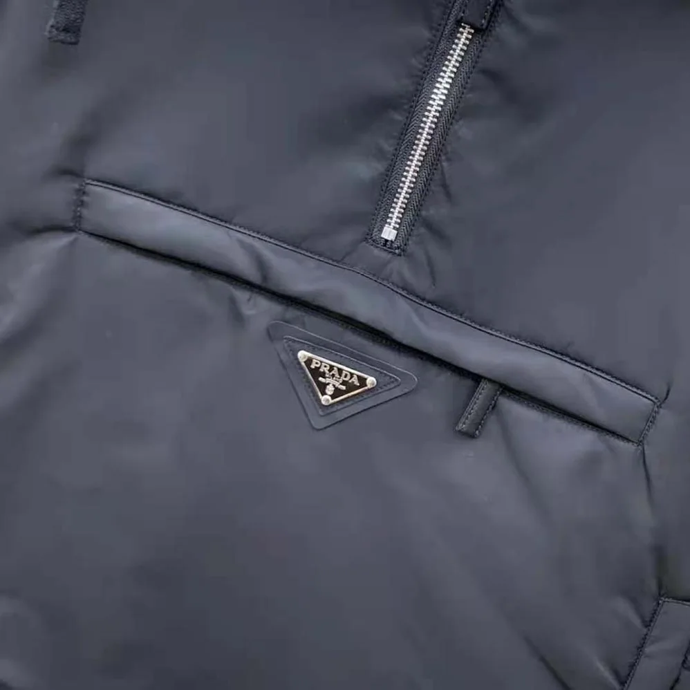 Prada Re-Nylon Blouson Jacket with Enameled Metal Triangle Logo for Women in Black Prada Re-Nylon Blouson Jacket with Enameled Metal Triangle Logo for Women in Black