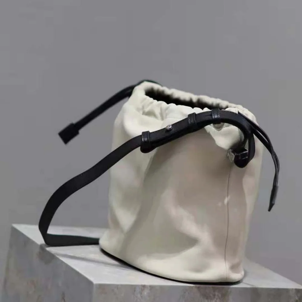 Saint Laurent YSL Rive Gauche Laced Bucket Bag in Smooth Leather for Men in Beige