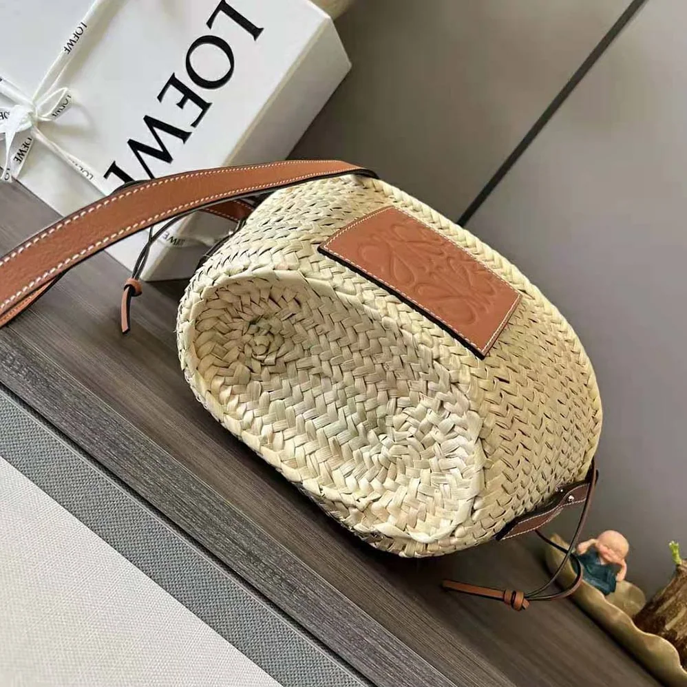 Loewe Drawstring Bucket Bag in Palm Leaf and Calfskin for Women in Brown Loewe Drawstring Bucket Bag in Palm Leaf and Calfskin for Women in Brown