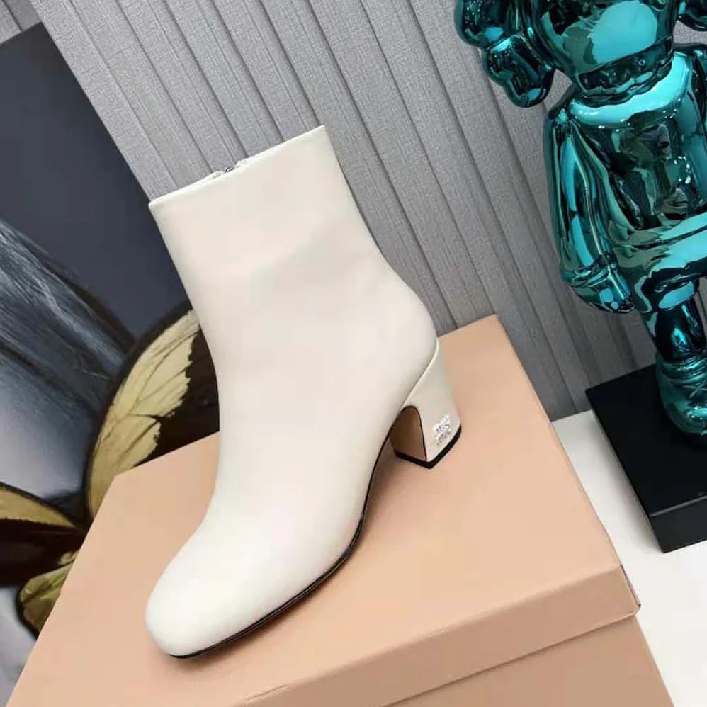 Miu Miu Leather Booties with Metal Lettering Logo for Women in White