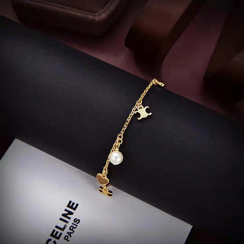 Celine Cœur Celine Charms Bracelet in Brass with Gold Finish and Resin Pearl for Women