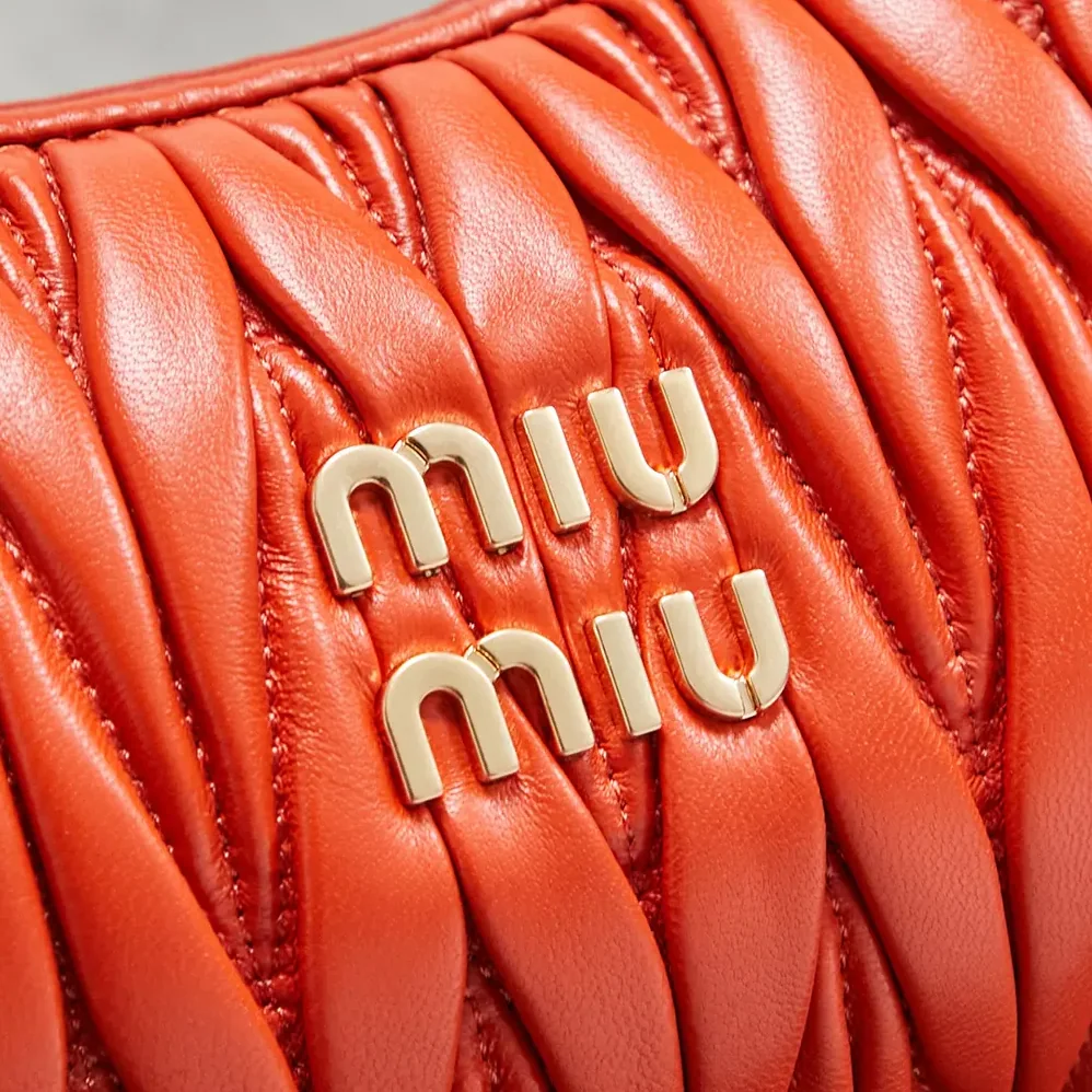 Miu Miu Wander Matelassé Nappa Leather Hobo Bag for Women in Orange Miu Miu Wander Matelassé Nappa Leather Hobo Bag for Women in Orange