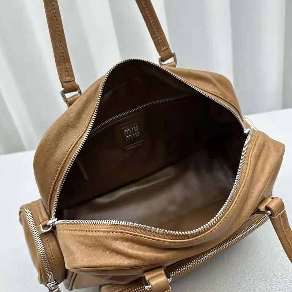 Miu Miu Nappa Leather Top-handle Bag with Embossed Lettering Logo for Women in Brown