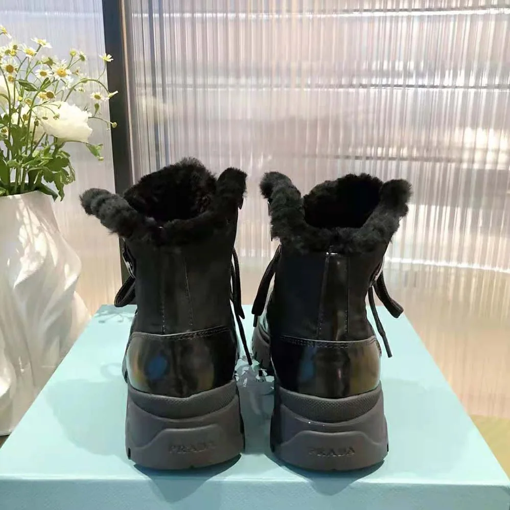 Prada Brixxen Leather and Nylon Booties for Women in Black