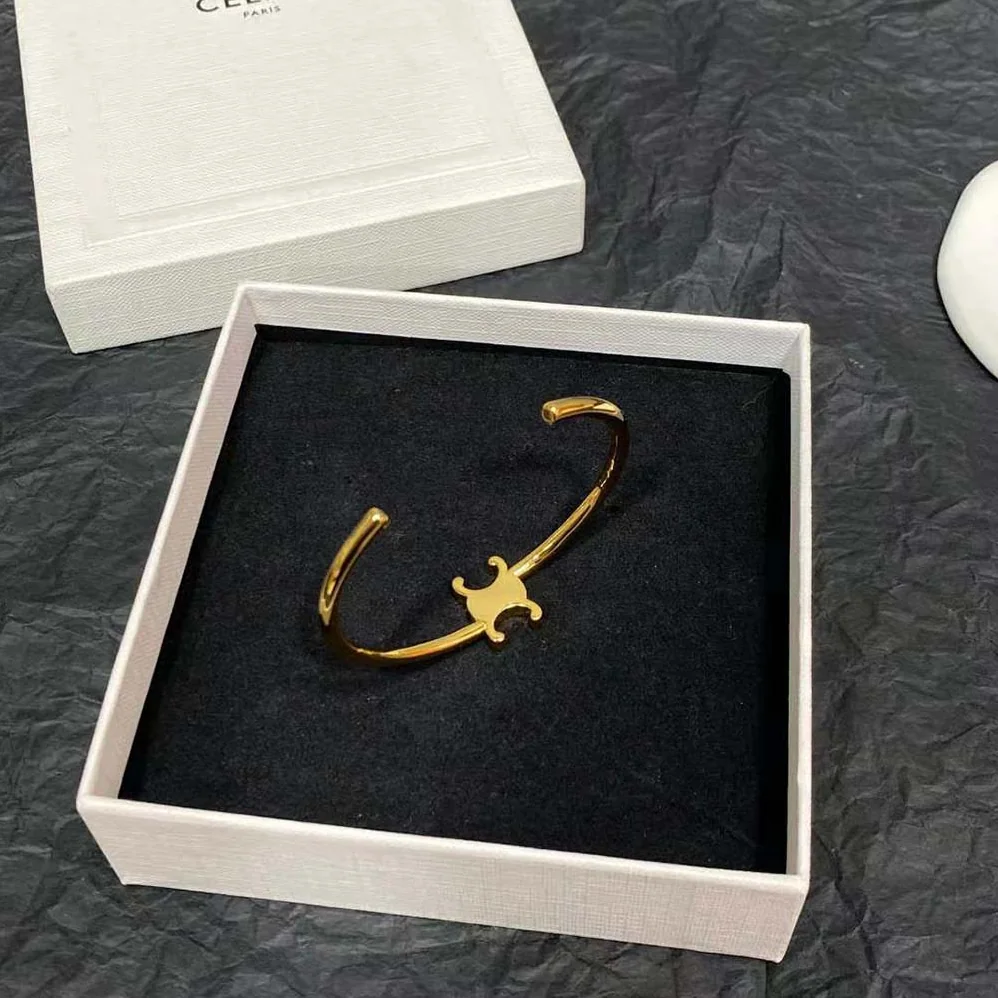 Celine Triomphe Asymmetric Cuff in Brass with Gold Finish for Women Celine Triomphe Asymmetric Cuff in Brass with Gold Finish for Women