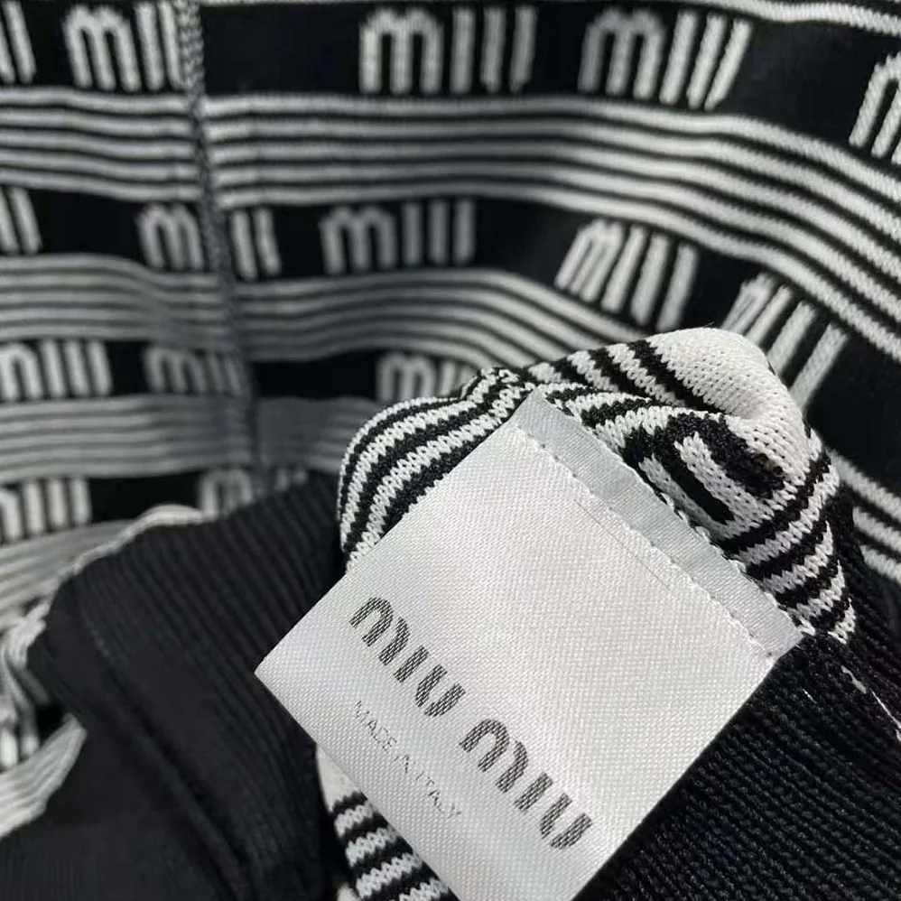 Miu Miu Viscose Turtleneck Cardigan with Jacquard Logo for Women in Black Miu Miu Viscose Turtleneck Cardigan with Jacquard Logo for Women in Black