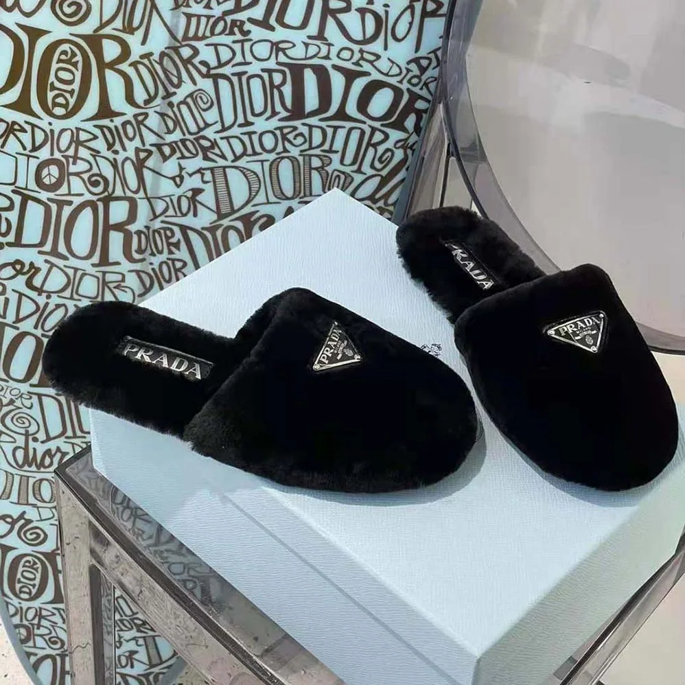 Prada Enameled Triangle Logo Accentuates Shearling Sabots for Women