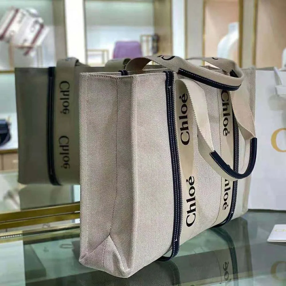 Chloe Large Woody Tote Bag in Cotton Canvas and Shiny Calfskin with Woody Ribbo for Women Chloe Large Woody Tote Bag in Cotton Canvas and Shiny Calfskin with Woody Ribbo for Women