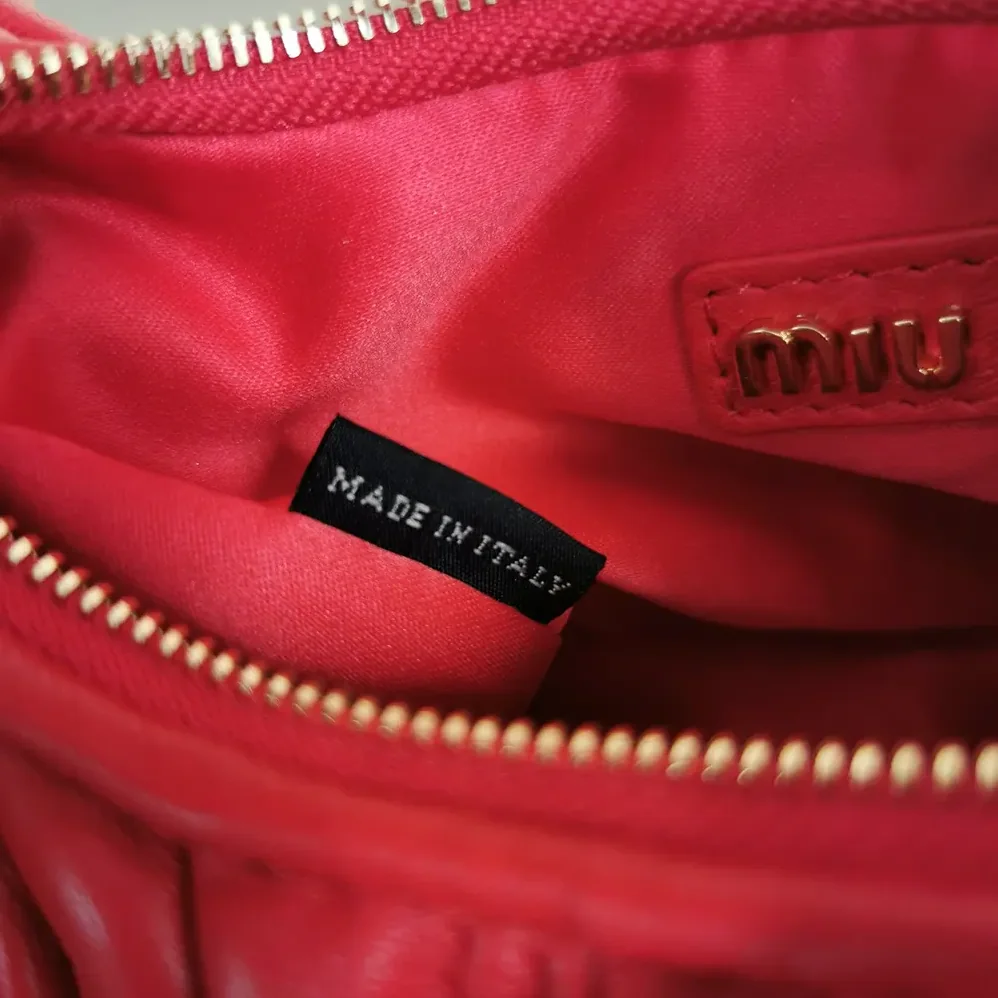 Miu Miu Wander Matelassé Nappa Leather Hobo Mini-Bag for Women in Red Miu Miu Wander Matelassé Nappa Leather Hobo Mini-Bag for Women in Red