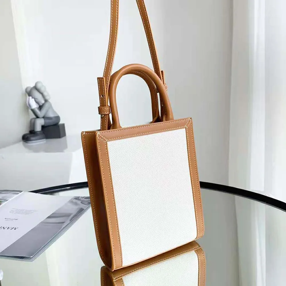 Celine Mini Vertical Cabas Celine in Textile with Celine Print and Calfskin for Women in White Celine Mini Vertical Cabas Celine in Textile with Celine Print and Calfskin for Women in White