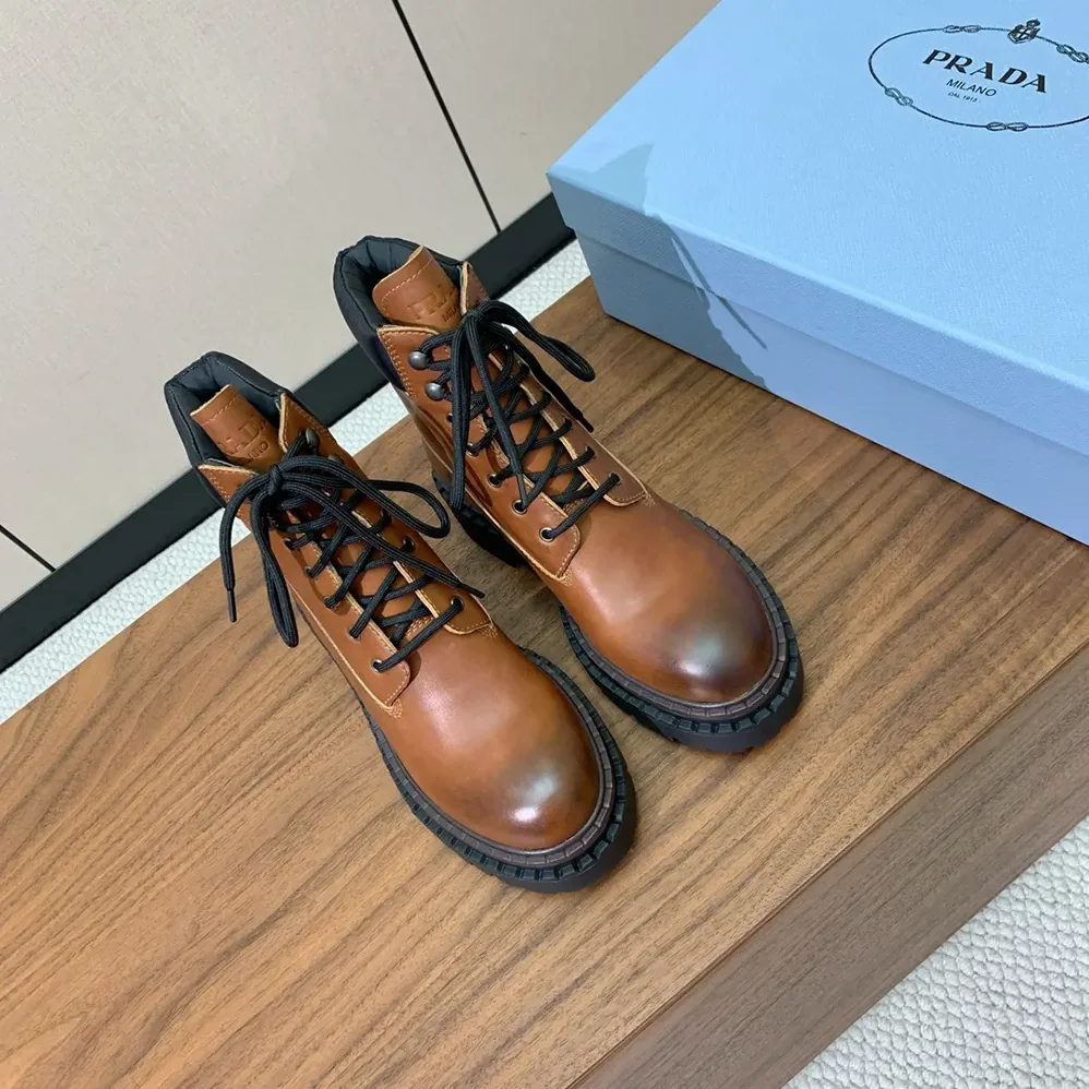 Prada Leather and Re-Nylon booties for Unisex in Ebony