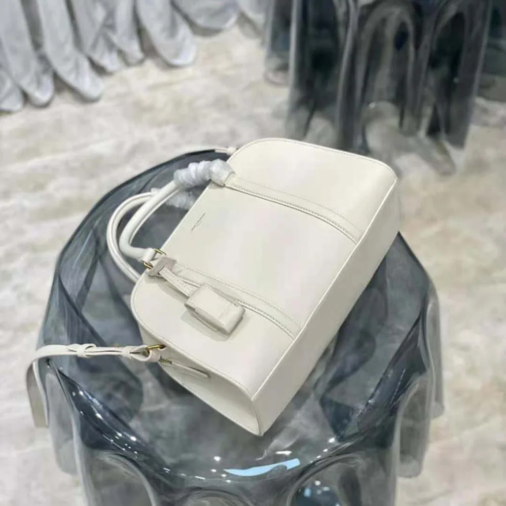 Saint Laurent YSL Lock Baby Duffle in Smooth Leather for Women in White Saint Laurent YSL Lock Baby Duffle in Smooth Leather for Women in White